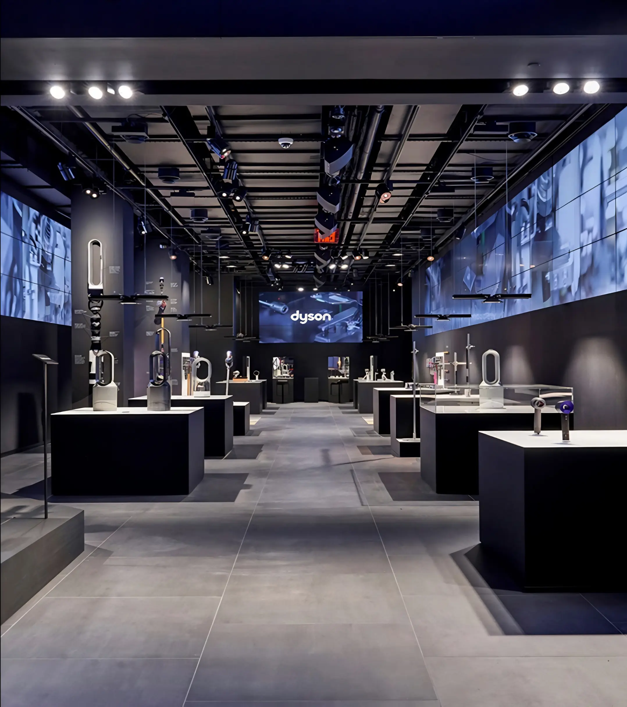 Untitled-design-24 Dyson showroom with illuminated product displays and wall-mounted screens